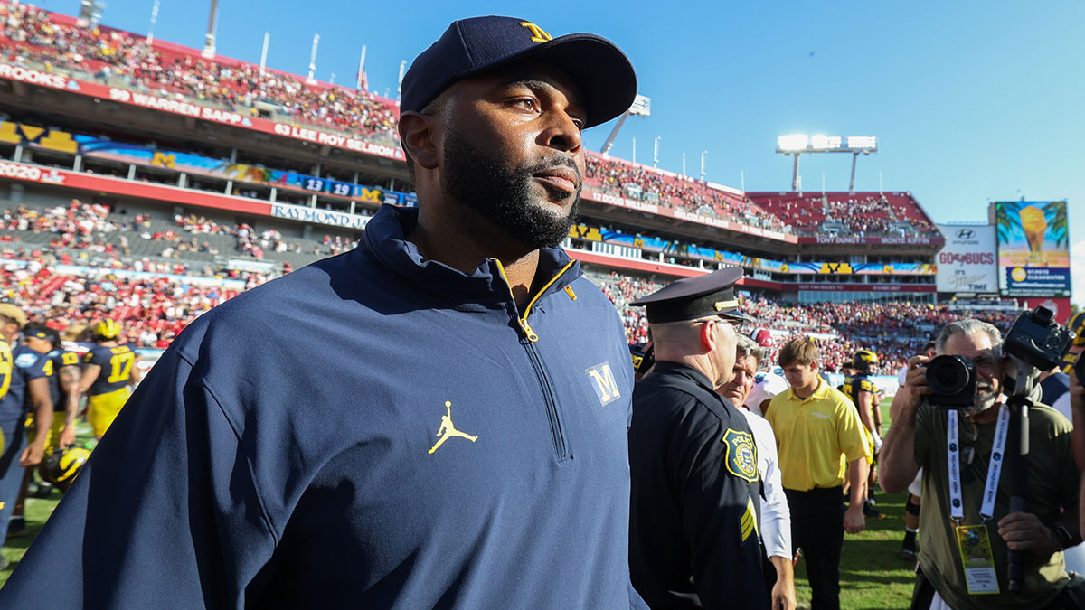 Michigan Wolverines head coach Sherrone Moore celebrates after beating the Alabama Crimson Tide in the ReliaQuest Bowl at Raymond James Stadium.