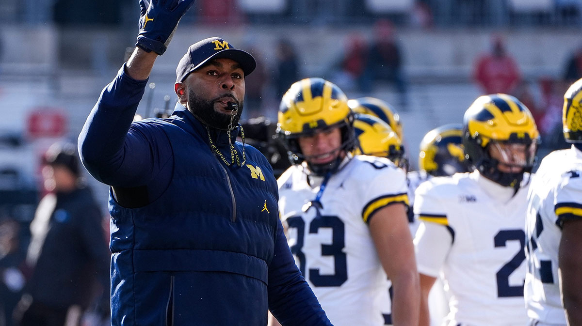 Michigan head coach Sherrone Moore watches warmups before the game between Ohio State and Michigan at Ohio Stadium