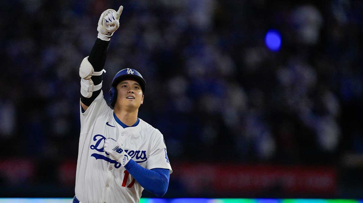 Los Angeles Dodgers designated hitter Shohei Ohtani (17) celebrates as he rounds the bases after hitting a three-run home run against the Athletics during the third inning of the game at Dodger Stadium.