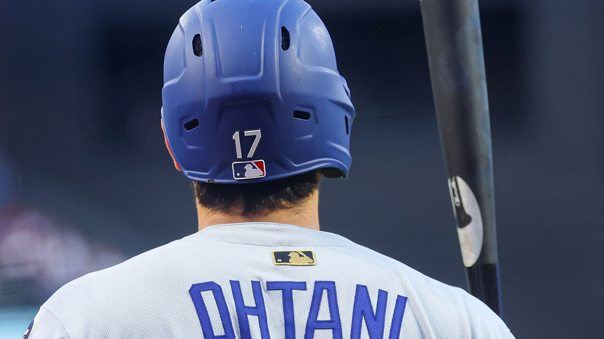 Los Angeles Dodgers designated hitter Shohei Ohtani (17) wears a gold MLB patch on the back of his uniform during the third inning against the New York Mets at Citi Field.