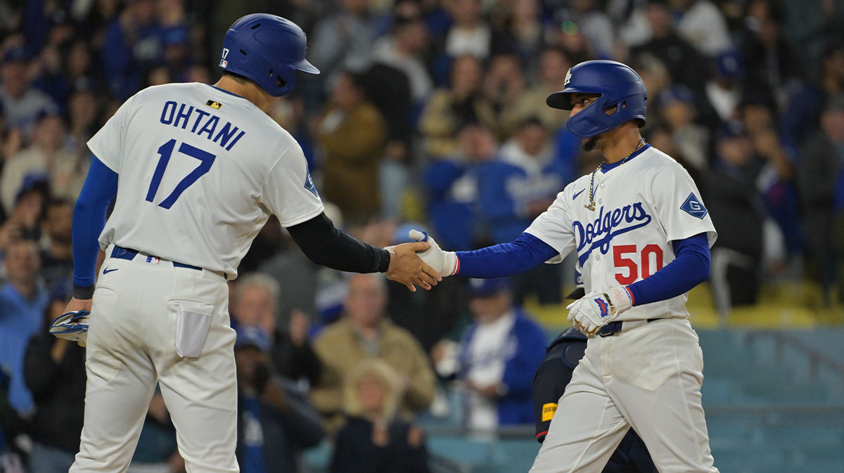 Apr 1, 2025; Los Angeles, California, USA; Los Angeles Dodgers two-way player Shohei Ohtani (17) high-fives shortstop Mookie Betts (50) after Betts hit a two run home run during the sixth inning against the Atlanta Braves at Dodger Stadium. Mandatory Credit: Jayne Kamin-Oncea-Imagn Images