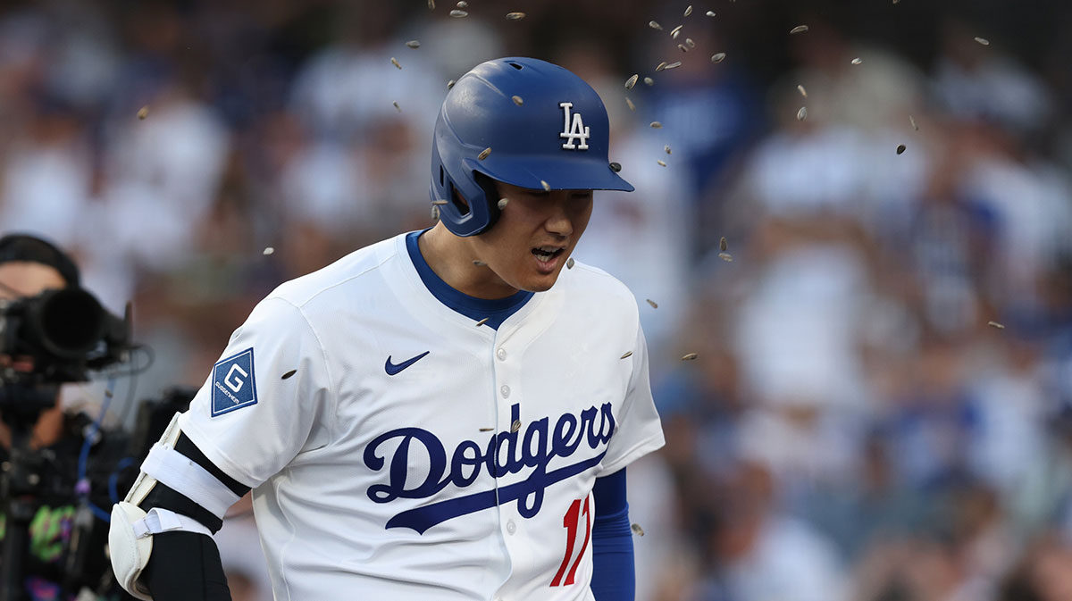 Los Angeles Dodgers two-way player Shohei Ohtani (17) is showered in peanuts after hitting a home run during the first inning against the New York Yankees at Dodger Stadium.