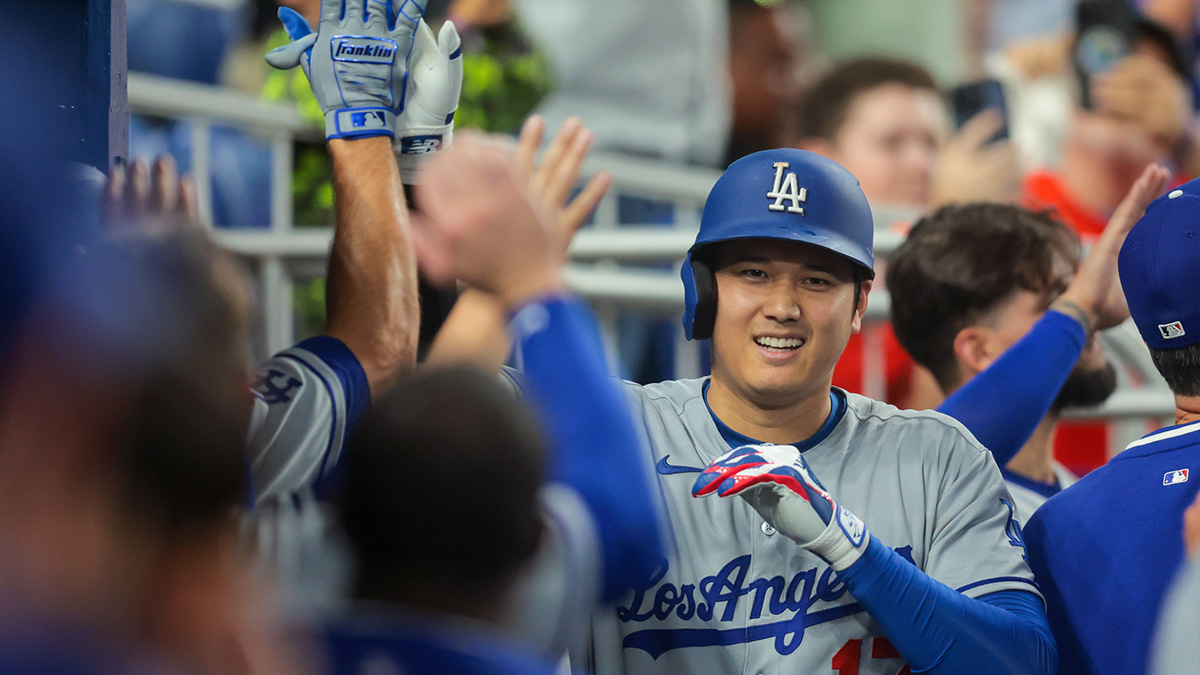 Los Angeles Dodgers designated hitter Shohei Ohtani (17) celebrates with teammates after hitting a two-run home run against the Miami Marlins during the fifth inning at loanDepot Park. Mandatory Credit: Sam Navarro-Imagn Images