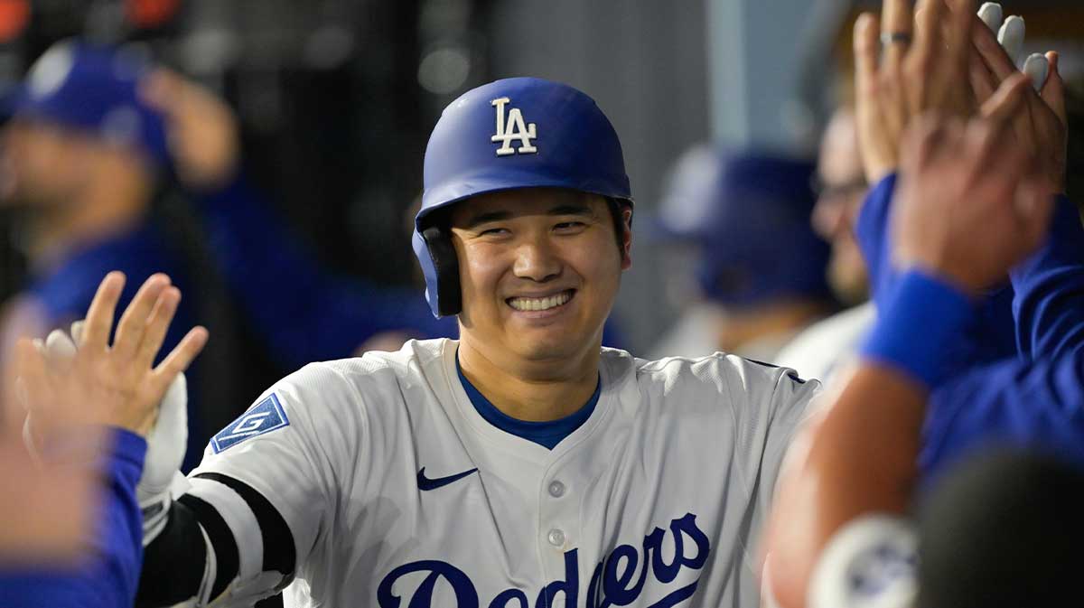 Los Angeles Dodgers designated hitter Shohei Ohtani (17) celebrates after hitting a three-run home run against the Athletics during the third inning of the game at Dodger Stadium.