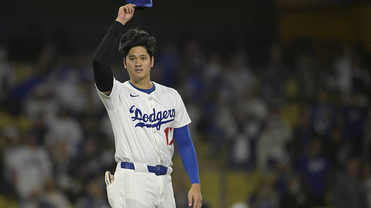 Los Angeles Dodgers designated hitter Shohei Ohtani (17) acknowledges the Athletics dugout following the final out of the ninth inning at Dodger Stadium.