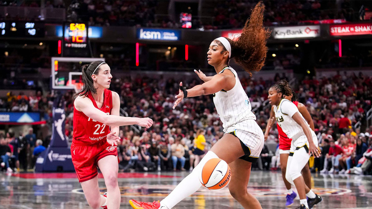 Indiana Fever guard Caitlin Clark (22) passes around Chicago Sky forward Angel Reese (5) on Saturday, May 17, 2025, during a game between the Indiana Fever and the Chicago Sky at Gainbridge Fieldhouse in Indianapolis. The Indiana Fever defeated the Chicago Sky, 93-58.