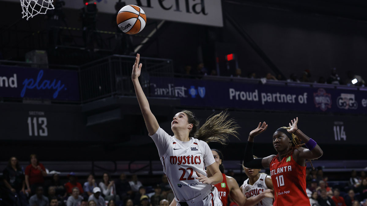 Washington Mystics guard Sonia Citron (22) shoots the ball as Atlanta Dream guard Rhyne Howard (10) looks on in the second half at CareFirst Arena.