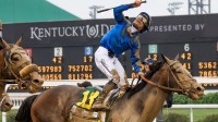 Jockey Junior Alvarado celebrated after riding Sovereignty to victory in the 151st Kentucky Derby at Churchill Downs