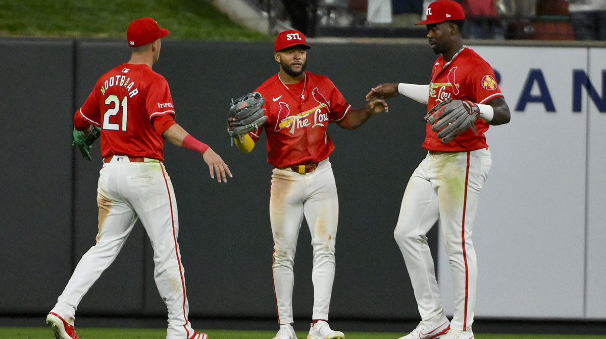 St. Louis Cardinals center fielder Victor Scott II (11) left fielder Lars Nootbaar (21) and right fielder Jordan Walker (18) celebrate after the Cardinals defeated the Milwaukee Brewers at Busch Stadium.