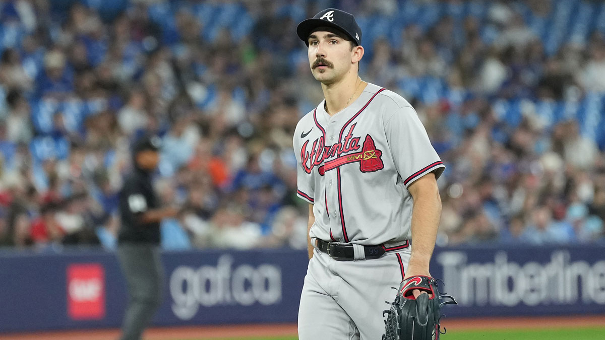 Atlanta Braves starting pitcher Spencer Strider (99) walks towards the dugout after being relieved during the seventh inning against the Toronto Blue Jays.