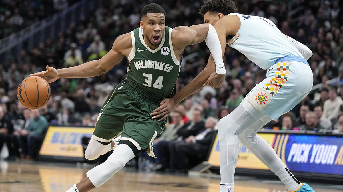 Milwaukee Bucks forward Giannis Antetokounmpo (34) drives for the basket against San Antonio Spurs forward Victor Wembanyama (1) during the third quarter at Fiserv Forum.
