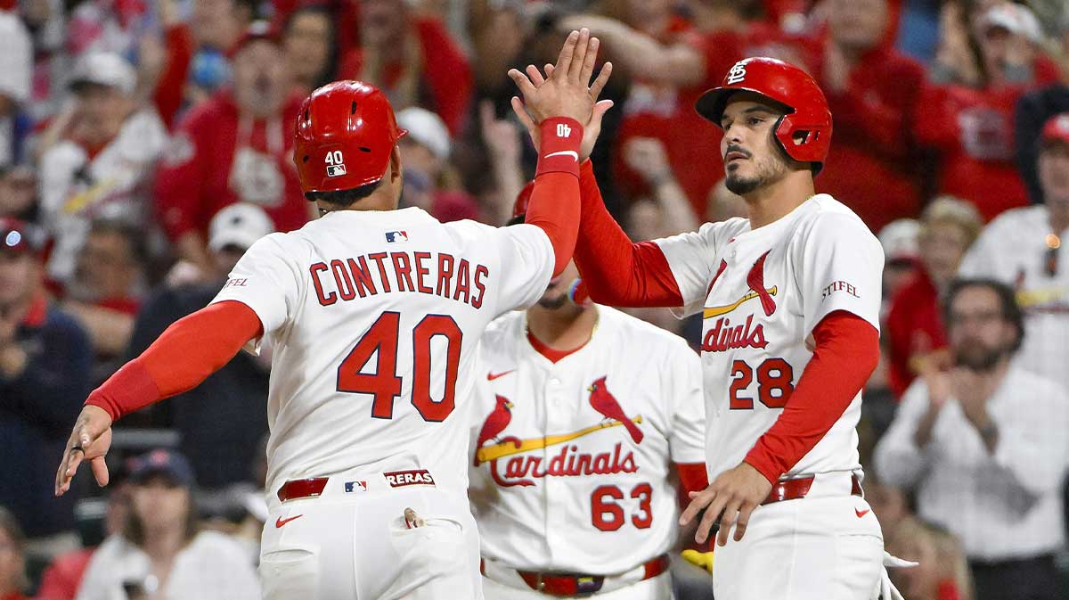 St. Louis Cardinals third baseman Nolan Arenado (28) celebrators with designated hitter Willson Contreras (40) after they both scored on a double by first baseman Alec Burleson (not pictured) against the Pittsburgh Pirates during the sixth inning at Busch Stadium.