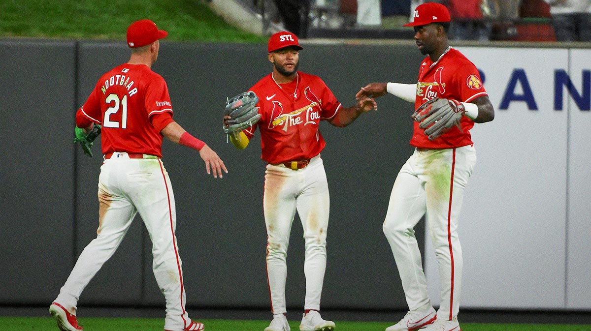 St. Louis Cardinals center fielder Victor Scott II (11) left fielder Lars Nootbaar (21) and right fielder Jordan Walker (18) celebrate after the Cardinals defeated the Milwaukee Brewers at Busch Stadium.