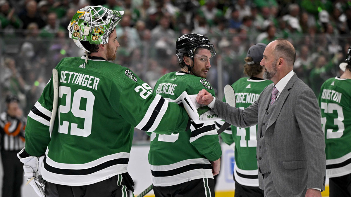 Dallas Stars head coach Peter DeBoer gives a fist bump to goaltender Jake Oettinger (29) after the Stars defeat the Vegas Golden Knights in game seven of the first round of the 2024 Stanley Cup Playoffs at American Airlines Center.
