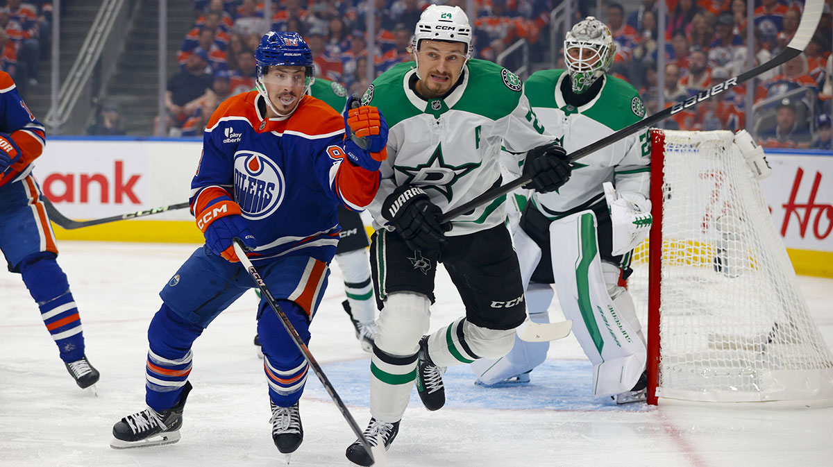 Edmonton Oilers center Ryan Nugent-Hopkins (93) and Dallas Stars center Roope Hintz (24) chase the puck during the first period in game four of the Western Conference Final of the 2025 Stanley Cup Playoffs at Rogers Place.