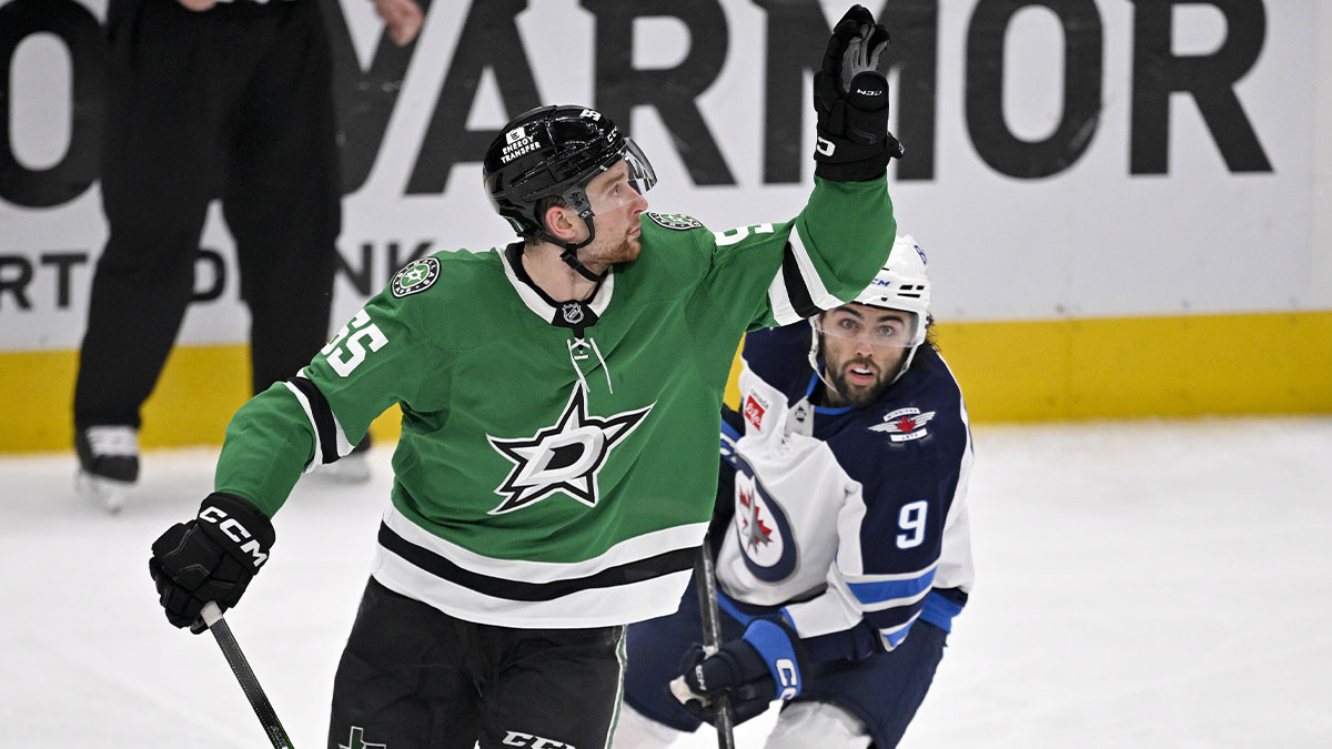 Dallas Stars defenseman Thomas Harley (55) catches the puck in the air as Winnipeg Jets left wing Alex Iafallo (9) looks on during the second period in game six of the second round of the 2025 Stanley Cup Playoffs at American Airlines Center.