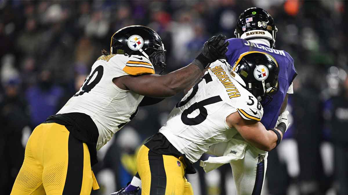 Pittsburgh Steelers defensive tackle Larry Ogunjobi (99) and linebacker Alex Highsmith (56) sack Baltimore Ravens quarterback Lamar Jackson (8) in the third quarter in an AFC wild card game at M&T Bank Stadium.