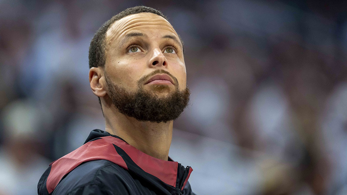 Golden State Warriors guard Stephen Curry (30) looks on from the bench against the Minnesota Timberwolves in the second half during game two of the second round for the 2025 NBA Playoffs at Target Center.