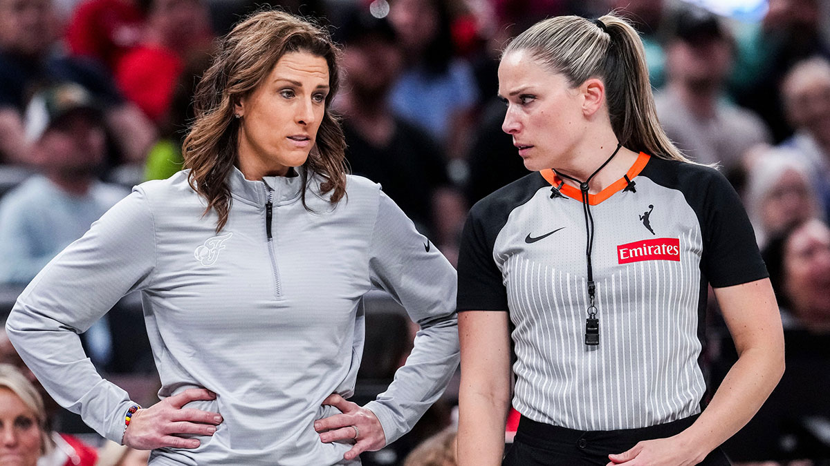 Indiana Fever head coach Stephanie White speaks with an official Saturday, May 3, 2025, during a preseason game between the Indiana Fever and the Washington Mystics at Gainbridge Fieldhouse in Indianapolis.