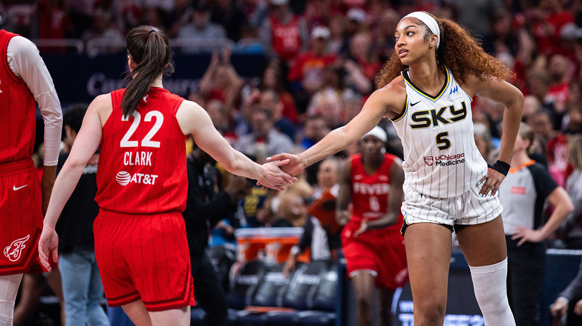 Indiana Fever guard Caitlin Clark (22) and Chicago Sky forward Angel Reese (5) shake hands before the game at Gainbridge Fieldhouse.