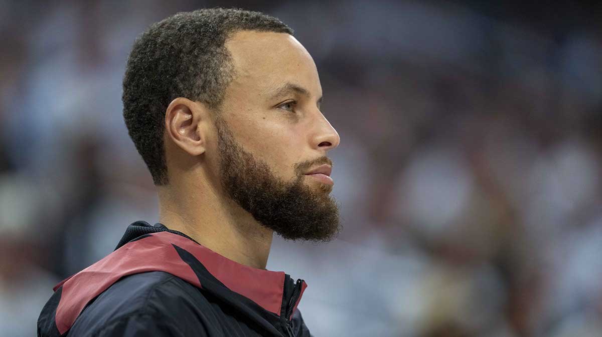 Golden State Warriors guard Stephen Curry (30) looks on from the bench against the Minnesota Timberwolves in the second half during game two of the second round for the 2025 NBA Playoffs.