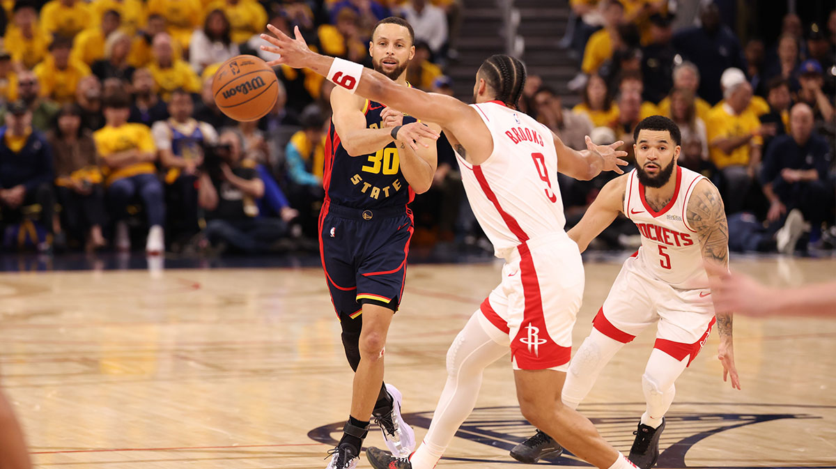 Golden State Warriors guard Stephen Curry (30) passes the ball against Houston Rockets forward/guard Dillon Brooks (9) during the second quarter of game four of the 2025 NBA Playoffs first round at Chase Center.