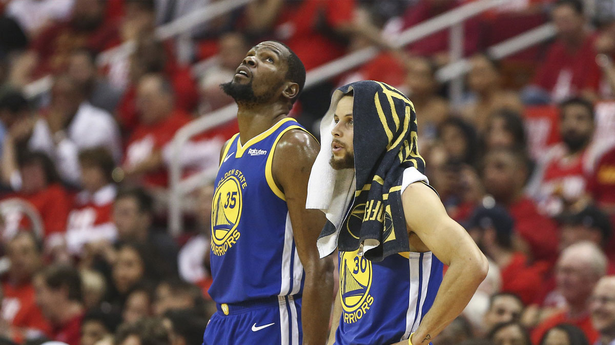 Golden State Warriors forward Kevin Durant (35) and guard Stephen Curry (30) look on during the third quarter against the Houston Rockets in game four of the second round of the 2019 NBA Playoffs at Toyota Center. 