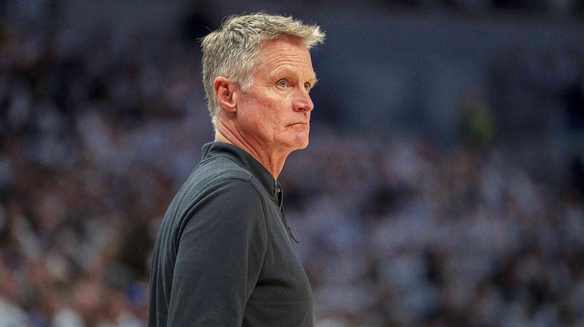 Warriors head coach Steve Kerr looks on against the Minnesota Timberwolves during game two of the second round for the 2025 NBA Playoffs at Target Center with Warriors All-Star Stephen Curry in the background