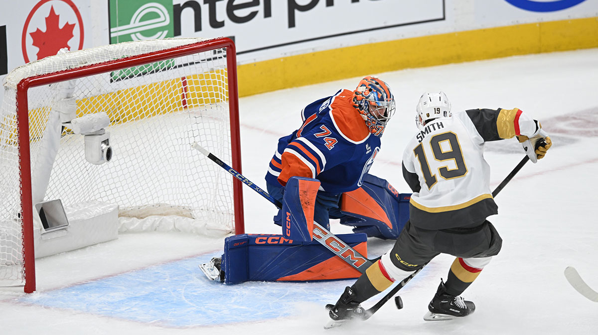 Edmonton Oilers goalie Stuart Skinner (74) battles for the puck with Vegas Golden Knights right winger Reilly Smith (19) during the first period in game three of the second round of the 2025 Stanley Cup Playoffs at Rogers Place.