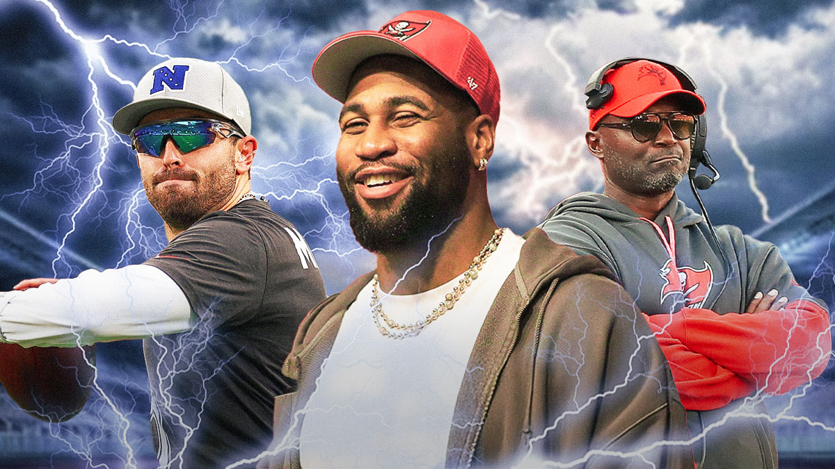 Haason Reddick in the middle, Baker Mayfield and Coach Todd Bowles around him, Stormy skies in the background