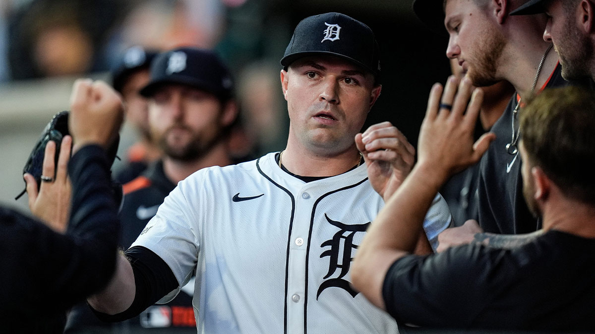 Detroit Tigers pitcher Tarik Skubal (29) high-fives teammates in the dugout after pitching change during the seventh inning at Comerica Park