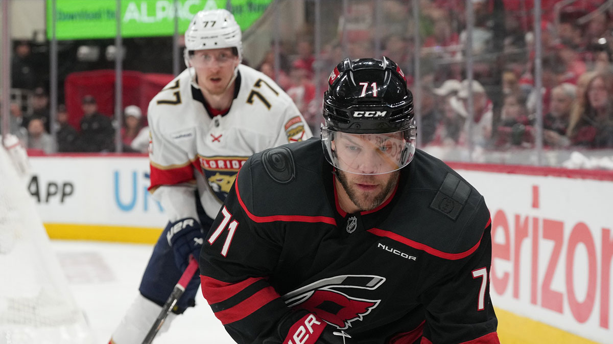 Carolina Hurricanes forward Taylor Hall (71) goes into the corner against Florida Panthers defenseman Niko Mikkola (77) during the third period in game two of the Eastern Conference Final of the 2025 Stanley Cup Playoffs at Lenovo Center.