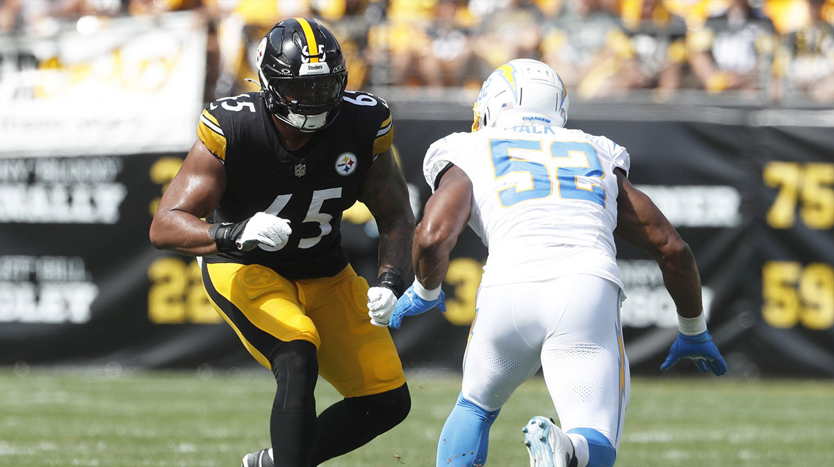 Pittsburgh Steelers offensive tackle Dan Moore Jr. (65) blocks Los Angeles Chargers linebacker Khalil Mack (52) at the line of scrimmage against at Acrisure Stadium.