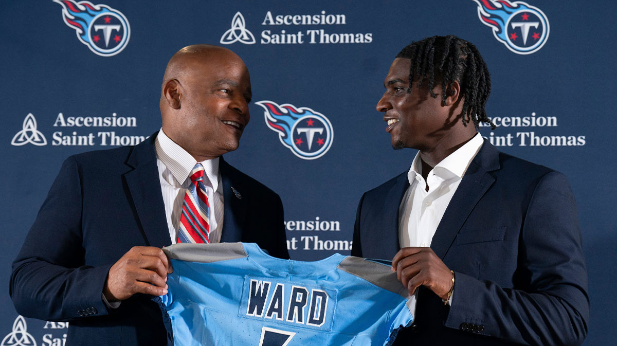 NFL Hall of Fame quarterback Warren Moon, left, poses for pictures with Cam Ward who earlier had been introduced as the Tennessee Titans first-round pick – and overall number one pick – in the NFL Draft at Ascension Saint Thomas Sports Park in Nashville, Tenn., Friday, April 25, 2025. Moon, whose No. 1 jersey is retired for the Tennessee Titans, allowed Ward to wear his number