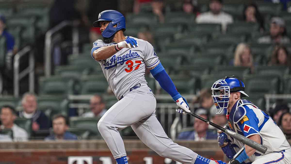 Los Angeles Dodgers right fielder Teoscar Hernandez (37) singles to drive in a run against the Atlanta Braves during the third inning at Truist Park.