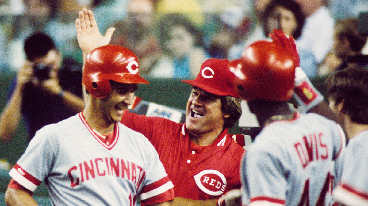 Cincinnati Reds manager Pete Rose greets first baseman Terry Francona (10) at the dugout during the 1987 season.