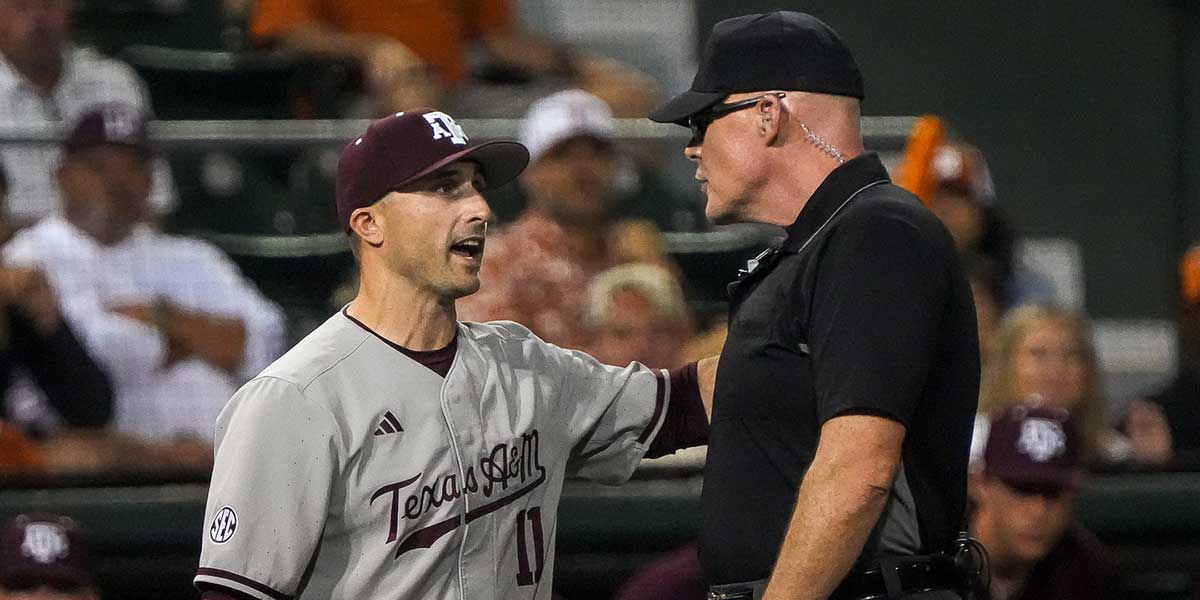 Texas A&M head coach Michael Earley talks to an official during the Lone Star Showdown against Texas at UFCU Disch-Falk Field on Friday, April 25, 2025.