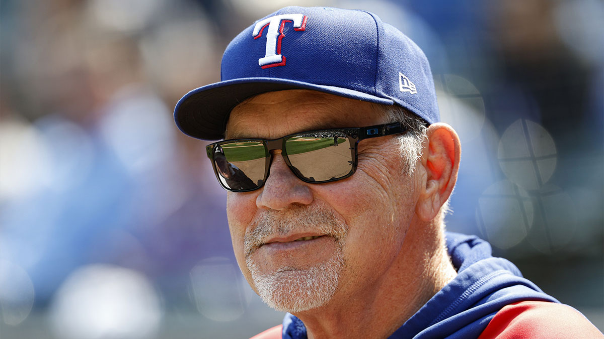 Texas Rangers manager Bruce Bochy (15) smiles before a baseball game against the Chicago White Sox at Rate Field.