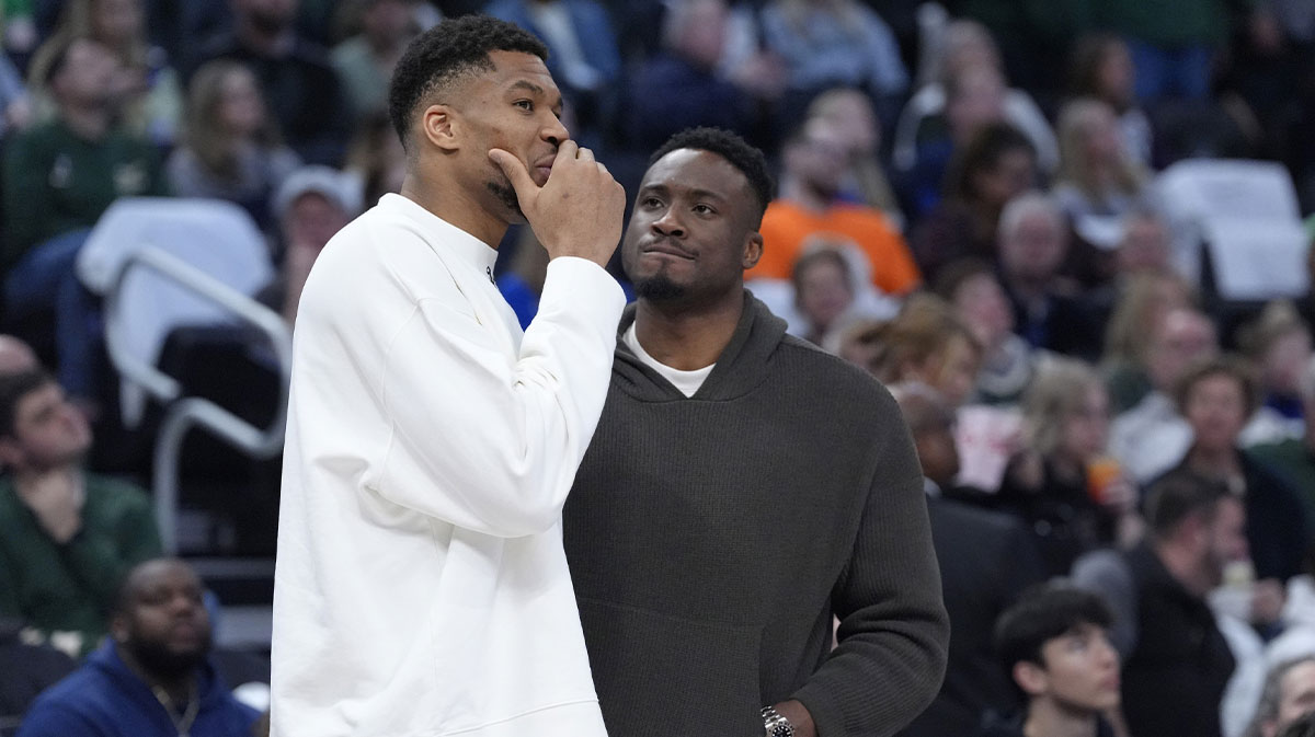 Milwaukee Bucks forward Giannis Antetokounmpo (34) and his brother Milwaukee Bucks forward Thanasis Antetokounmpo talks during a time out against the Detroit Pistons in the second half at Fiserv Forum.
