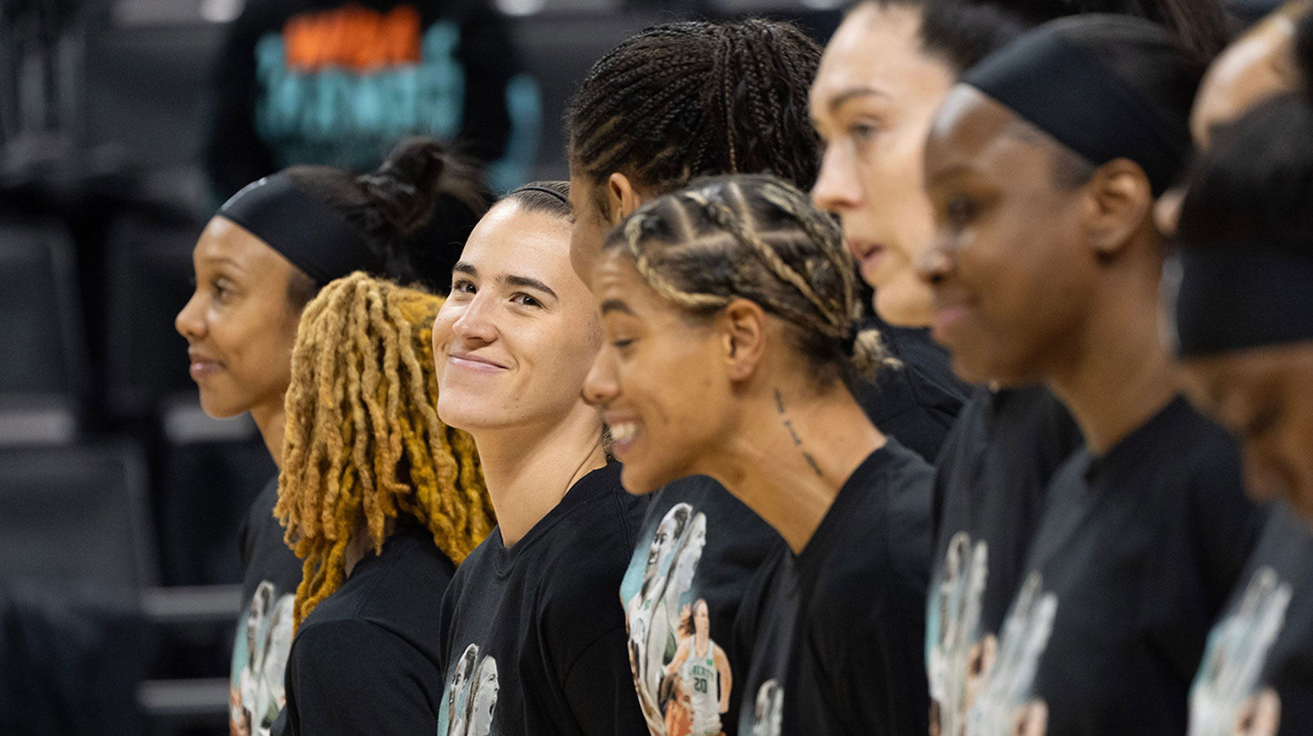 Sabrina Ionescu, center left, looks up at the sold-out crowd at Matthew Knight Arena during the National Anthem May 12, 2025 in Eugene.
