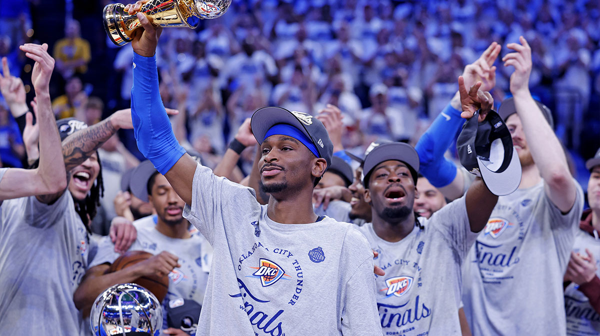 Oklahoma City Thunder guard Shai Gilgeous-Alexander (2) celebrates with Magic Johnson West Conference Finals MVP trophy after defeating the Minnesota Timberwolves in game five to win the western conference finals for the 2025 NBA Playoffs at Paycom Center.
