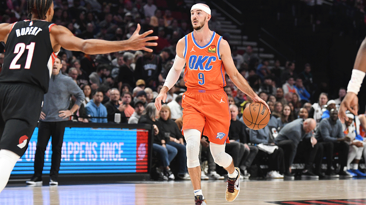 Oklahoma City Thunder guard Alex Caruso (9) brings the ball up court during the second quarter at Moda Center.