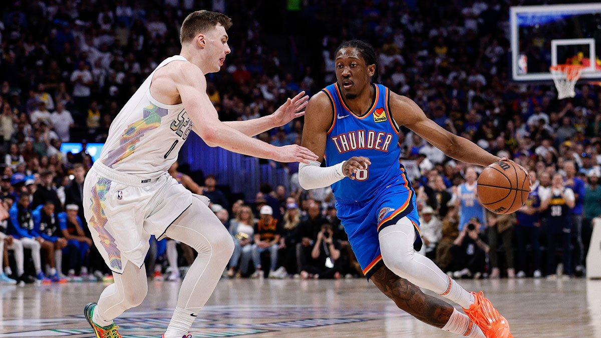 Thunder forward Jalen Williams (8) controls the ball as Denver Nuggets guard Christian Braun (0) guards in the second quarter during game six of the second round for the 2025 NBA Playoffs at Ball Arena