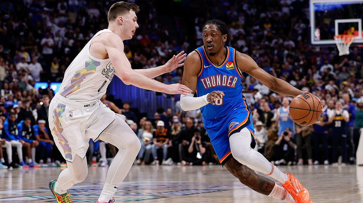 Thunder forward Jalen Williams (8) controls the ball as Denver Nuggets guard Christian Braun (0) guards in the second quarter during game six of the second round for the 2025 NBA Playoffs at Ball Arena. Mandatory Credit: Isaiah J. Downing-Imagn Images with Thunder All-Star Shai Gilgeous-Alexander in the background