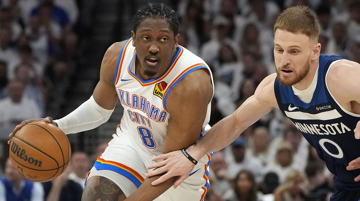 Thunder forward Jalen Williams (8) dribbles the ball past Minnesota Timberwolves guard Donte DiVincenzo (0) in the first half during game four of the western conference finals for the 2025 NBA Playoffs at Target Center