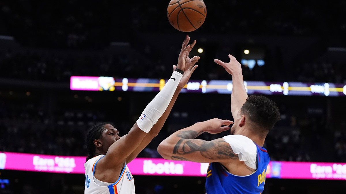 The Thunder Jalen Williams (8) striker shoots the ball from the Denver Nuggets striker Michael Porter Jr. (1) in the first quarter in the third round game for the NBA 2025 qualifiers in Ball Arena