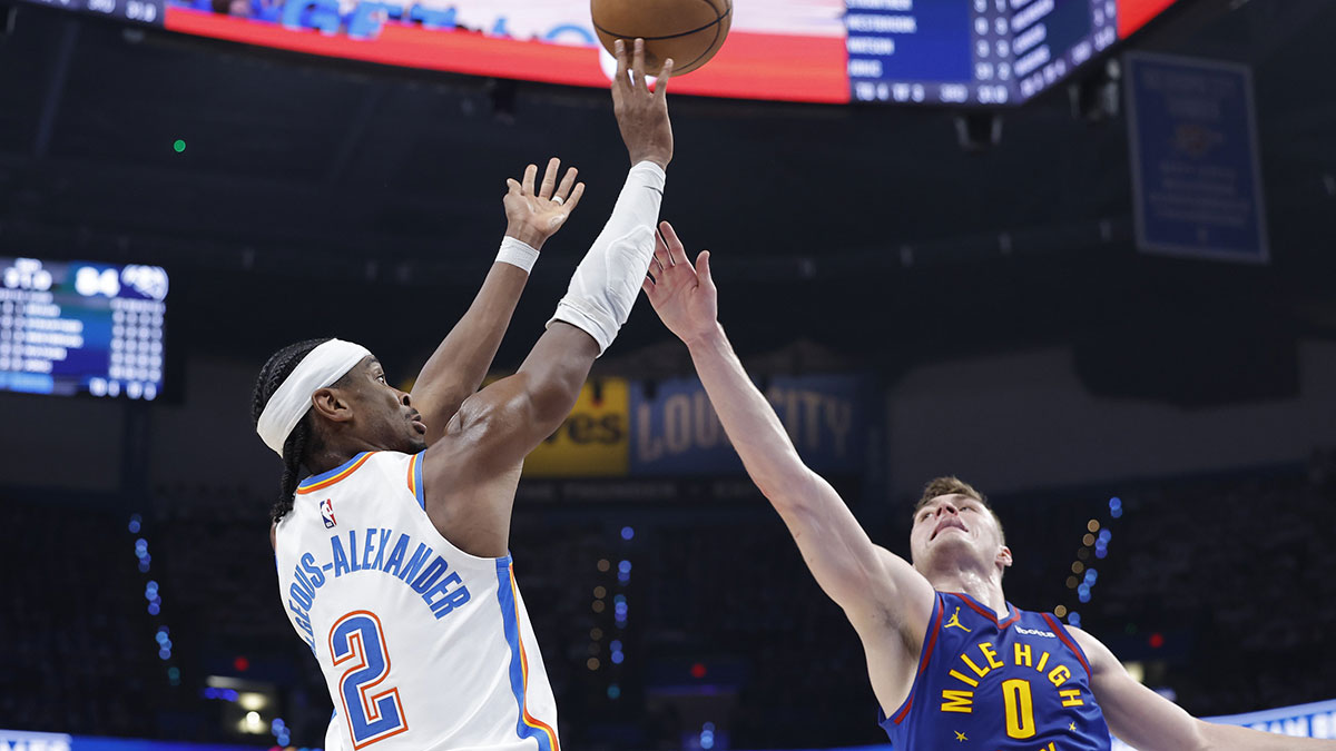 Thunder guard Shai Gilgeous-Alexander (2) shoots as Denver Nuggets guard Christian Braun (0) defends during the second half of game five of the second round for the 2025 NBA Playoffs at Paycom Center