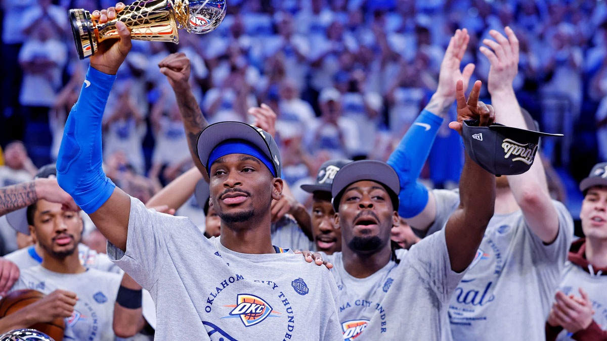 Thunder guard Shai Gilgeous-Alexander (2) celebrates with Magic Johnson West Conference Finals MVP trophy after defeating the Minnesota Timberwolves in game five to win the western conference finals for the 2025 NBA Playoffs at Paycom Center
