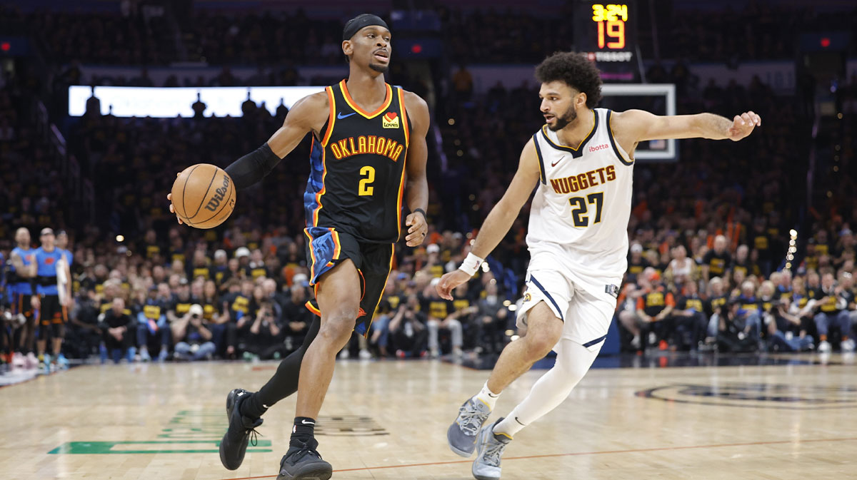Thunder guard Shai Gilgeous-Alexander (2) drives down the court beside Denver Nuggets guard Jamal Murray (27) in the second half during game two of the second round for the 2025 NBA Playoffs at Paycom Center
