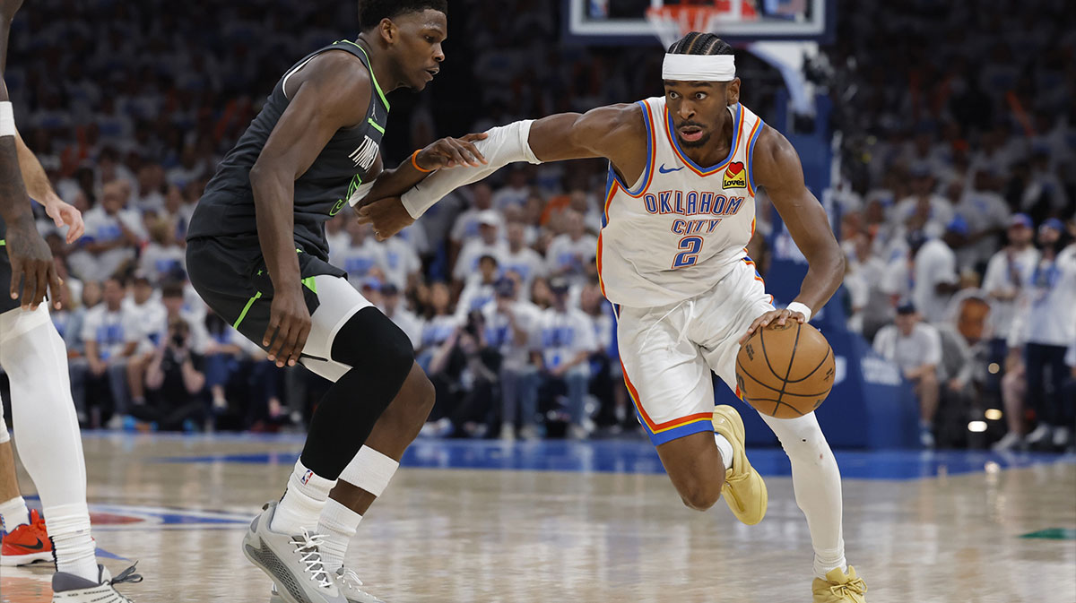 Thunder guard Shai Gilgeous-Alexander (2) drives against Minnesota Timberwolves guard Anthony Edwards (5) in the fourth quarter during game one of the western conference finals for the 2025 NBA Playoffs at Paycom Center